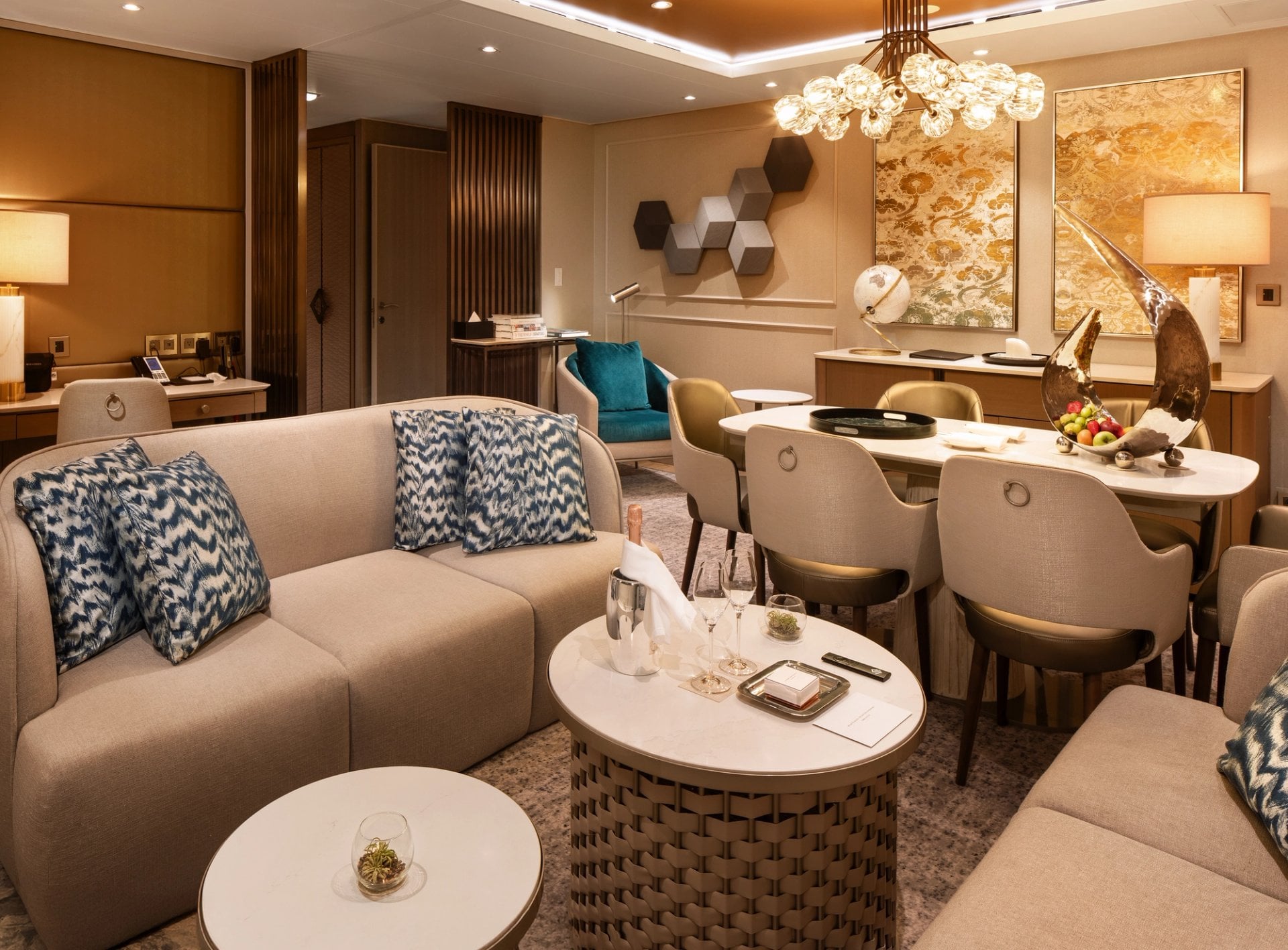 Silversea Silver Endeavour Owner's Suite living room with panoramic floor to ceiling glass overlooking Antarctic icebergs