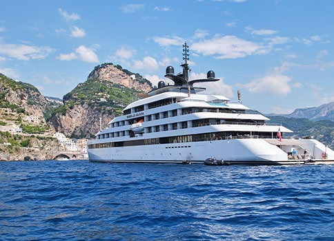 Luxury superyacht sailing on clear ocean waters