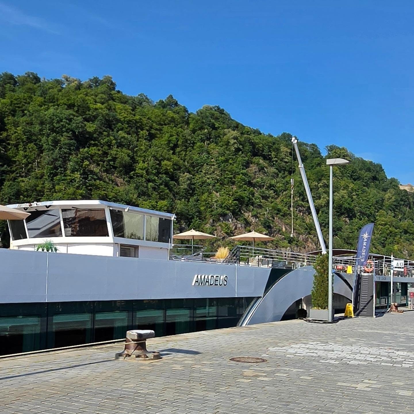 Amadeus Nova luxury hybrid river ship docked along the scenic Danube River valley