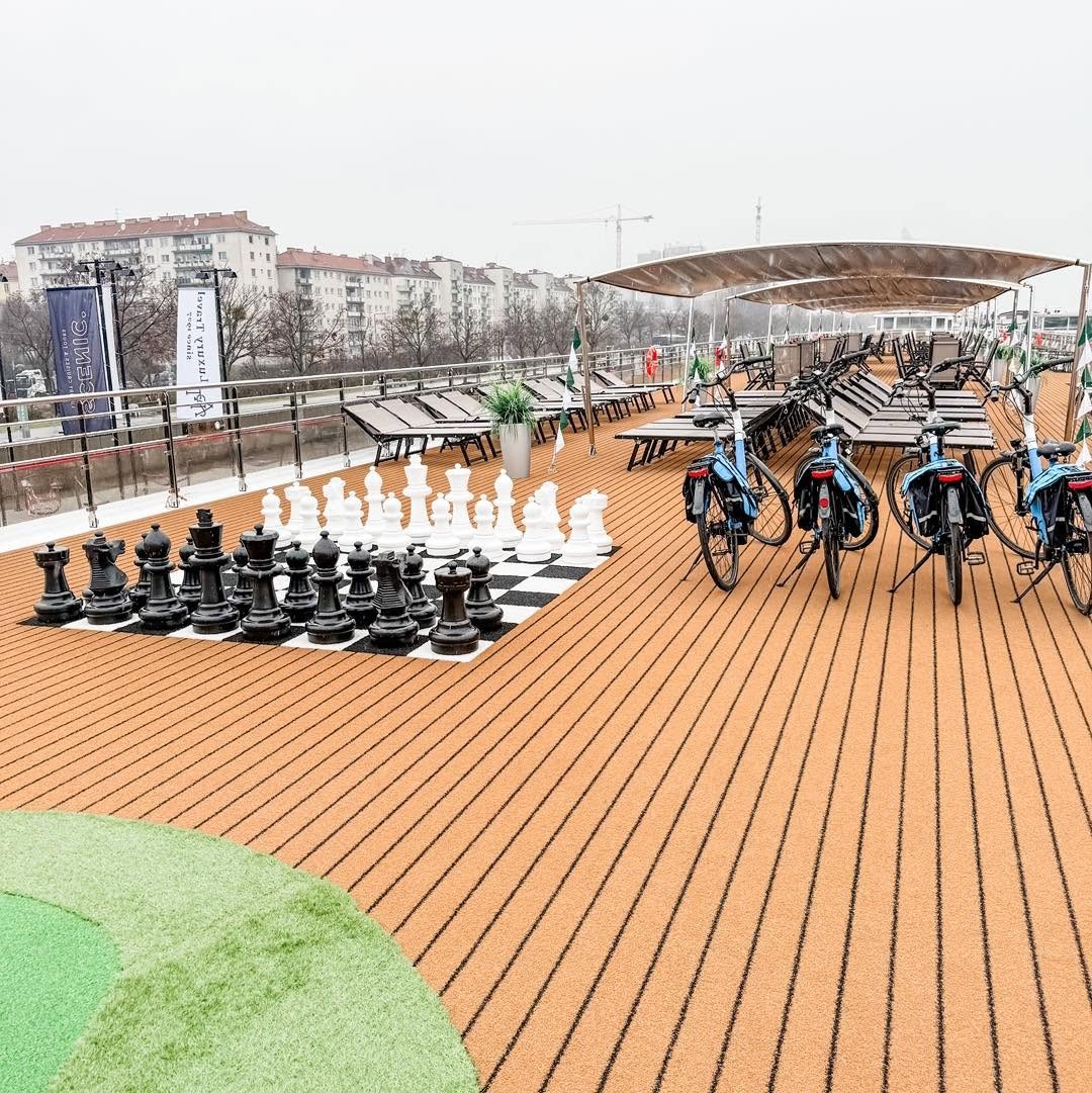 Sun Deck giant outdoor chess set, putting green, and touring bicycles aboard Amadeus Nova