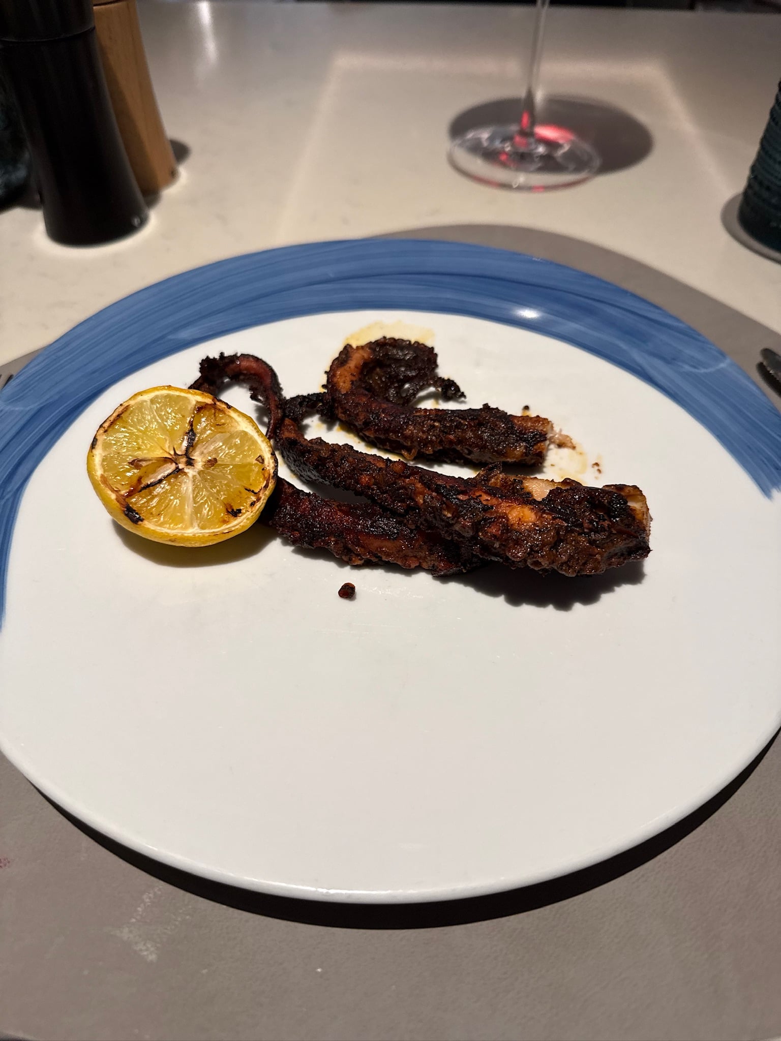 Charred Spanish octopus with grilled lemon on Ilma