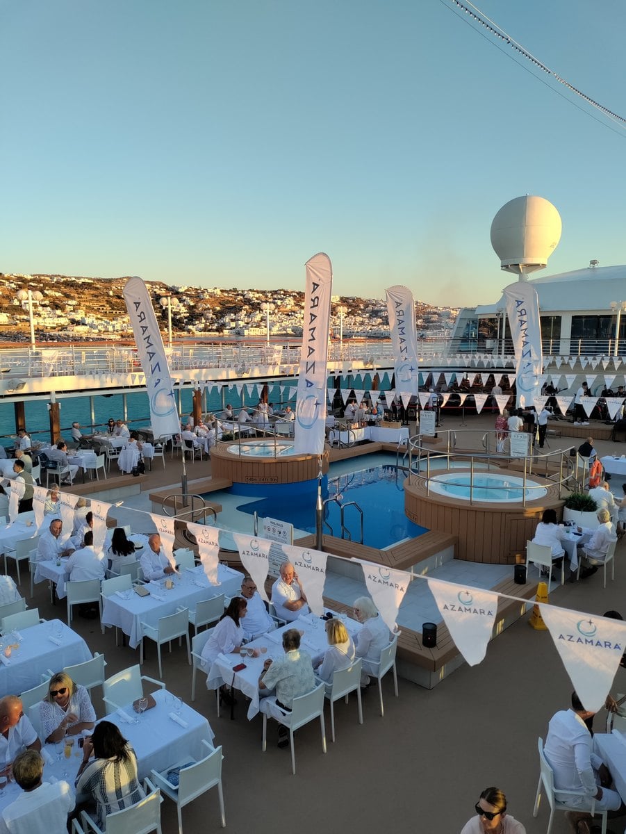 Lavish outdoor buffet setup on the pool deck during the Azamara White Night celebration