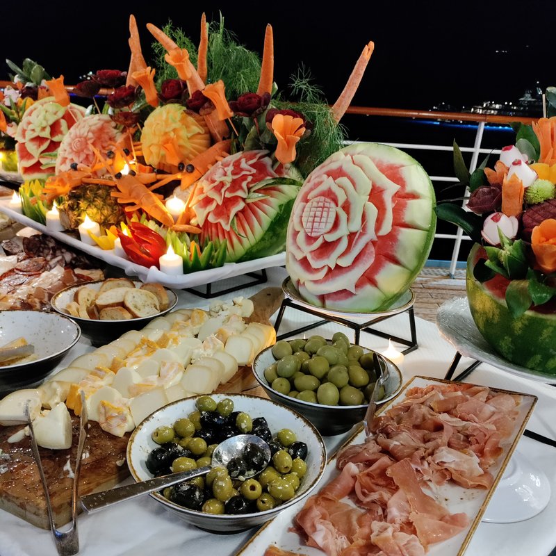 Lavish buffet spread and carved meats on the pool deck