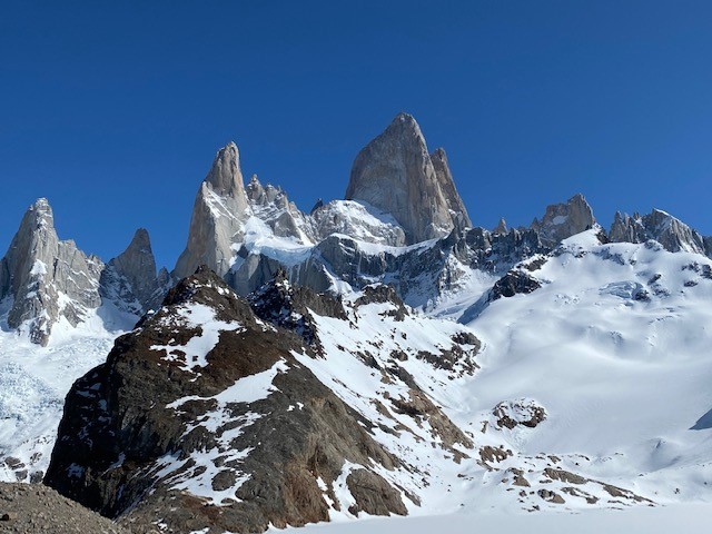 Expansive horizontal panorama of the Fitz Roy mountain range in El Chalten
