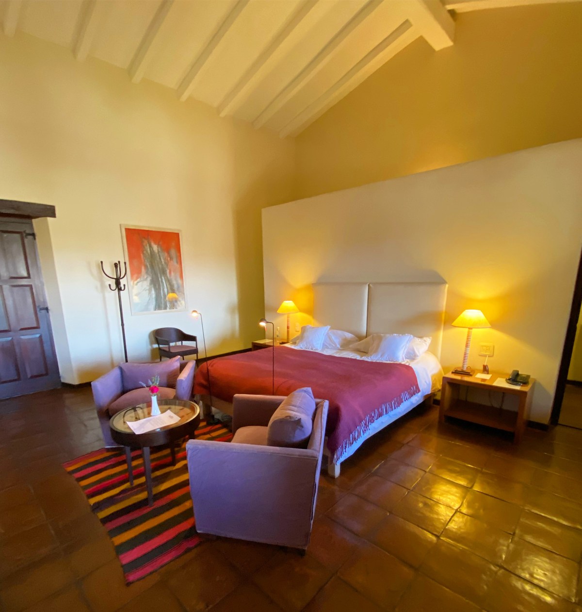 Spacious luxury suite with fireplace and private terrace at Estancia Colome