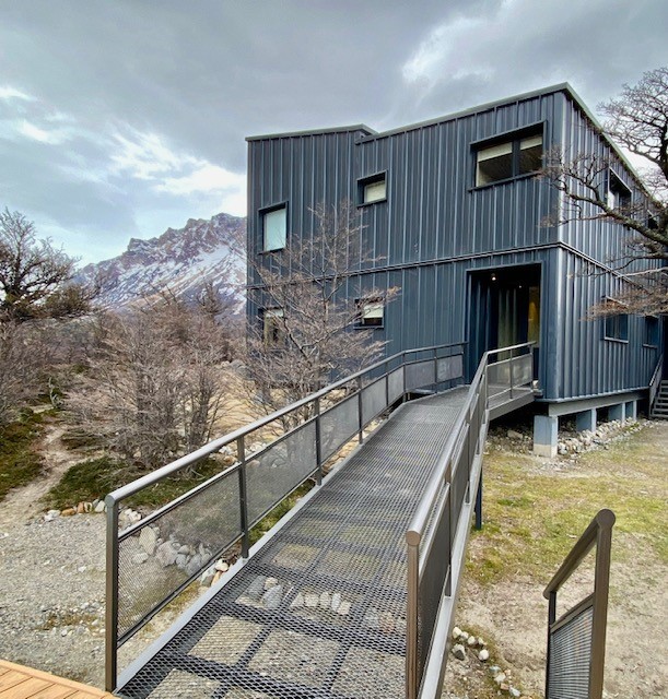 Exterior architecture of Explora El Chalten set against rugged Patagonian slopes
