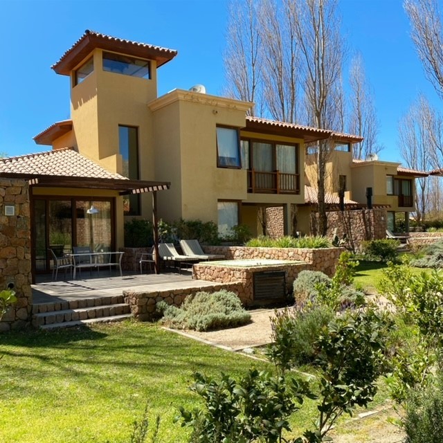 Plush master bedroom suite in a freestanding villa at Grace Cafayate