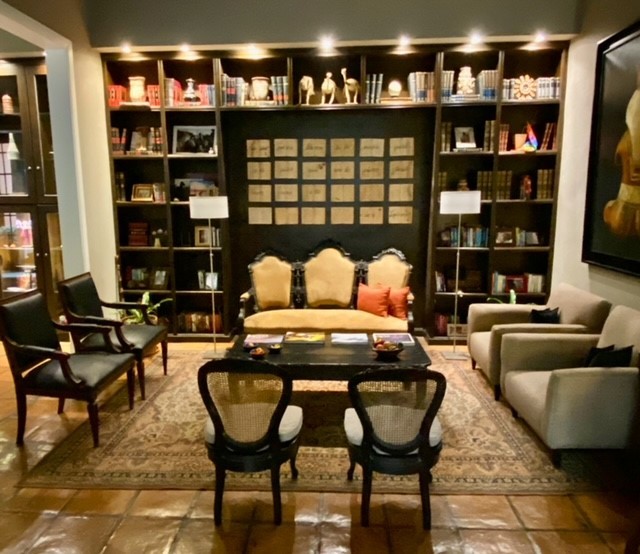 Cozy library lounge and fireplace at Legado Mitico boutique hotel in Salta