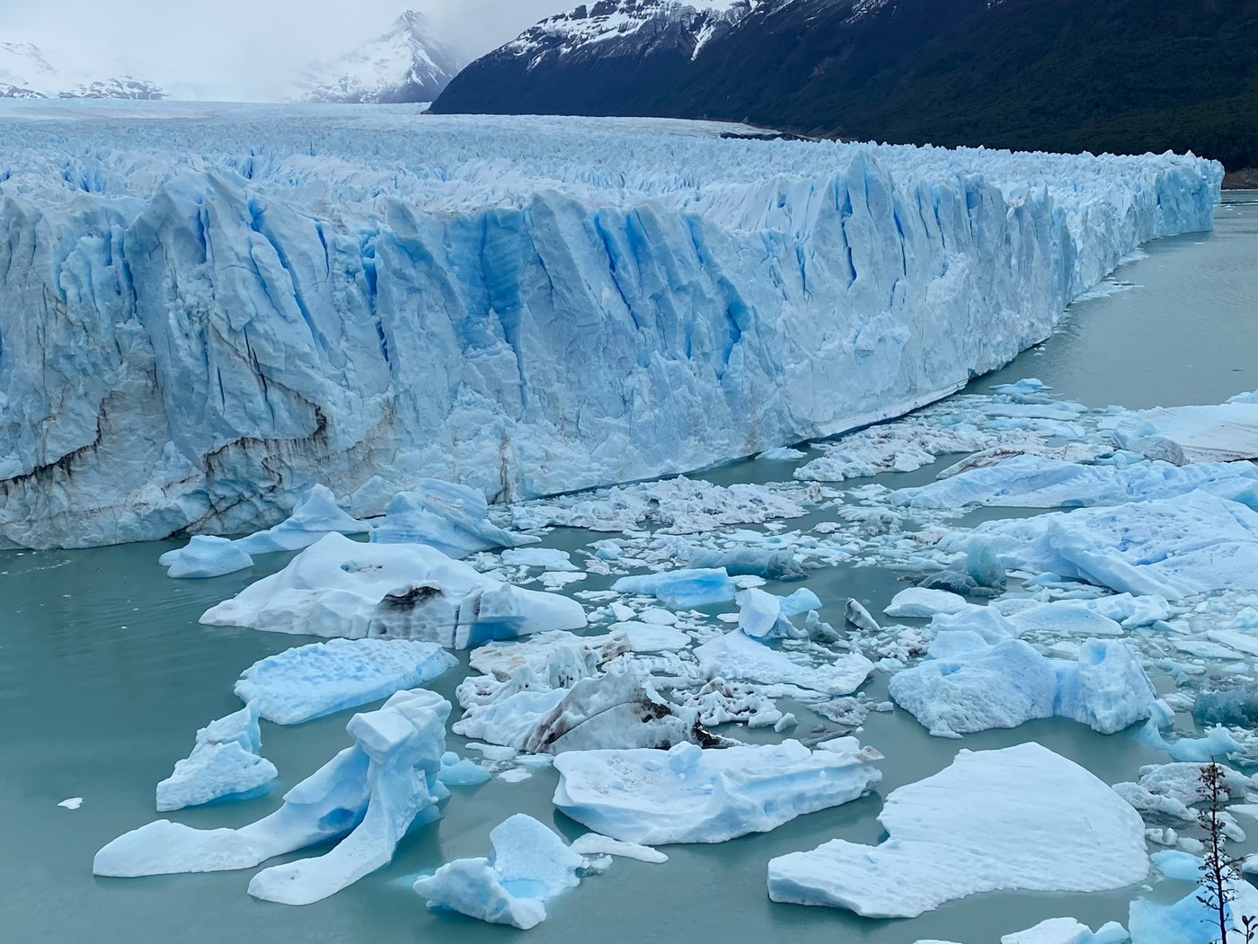 Close-up view of the jagged seracs and deep blue crevasses of Perito Moreno ice wall