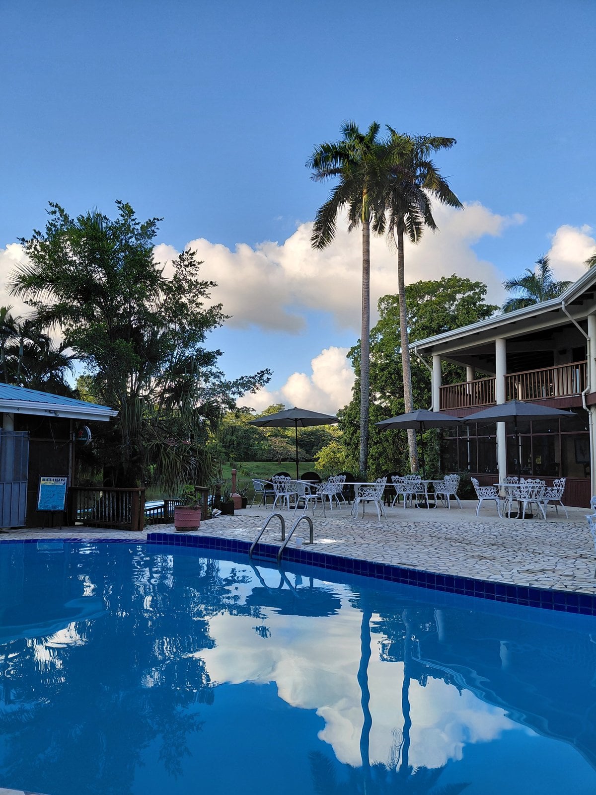 Black Orchid Resort riverside pool and tropical gardens in Burrell Boom, Belize