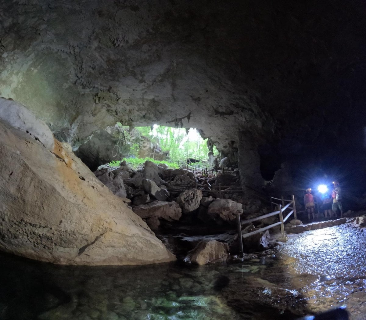 Cave tubing exploration through subterranean river at Nohoch Che'en Caves Branch