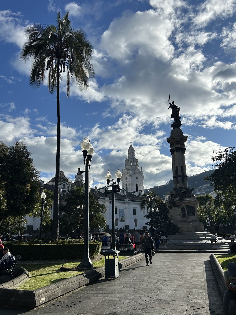 Quito Historic Old Town Plaza Grande with colonial architecture and palm trees