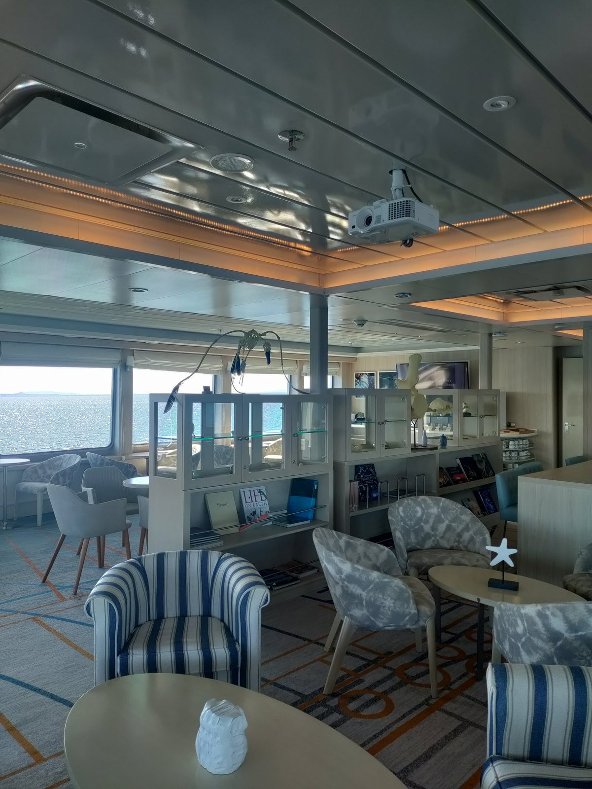 Plush twin-to-queen bedding and panoramic picture window aboard Santa Cruz II