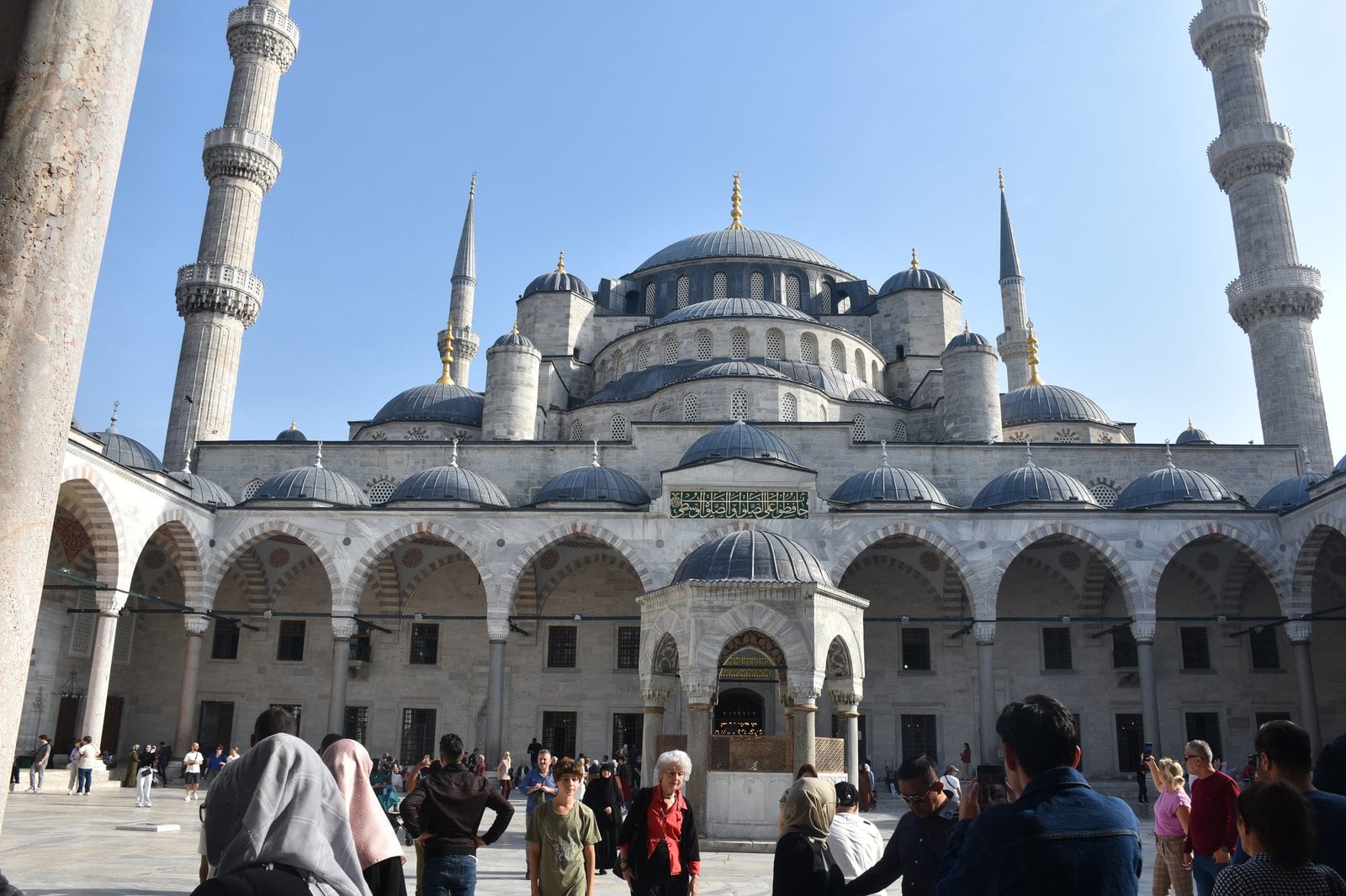 The expansive marble courtyard and arcaded cloister of the Blue Mosque