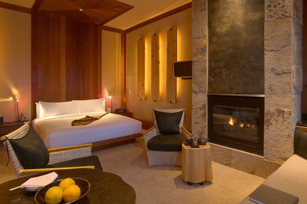 Amangani luxury suite with sandstone fireplace and mountain view terrace