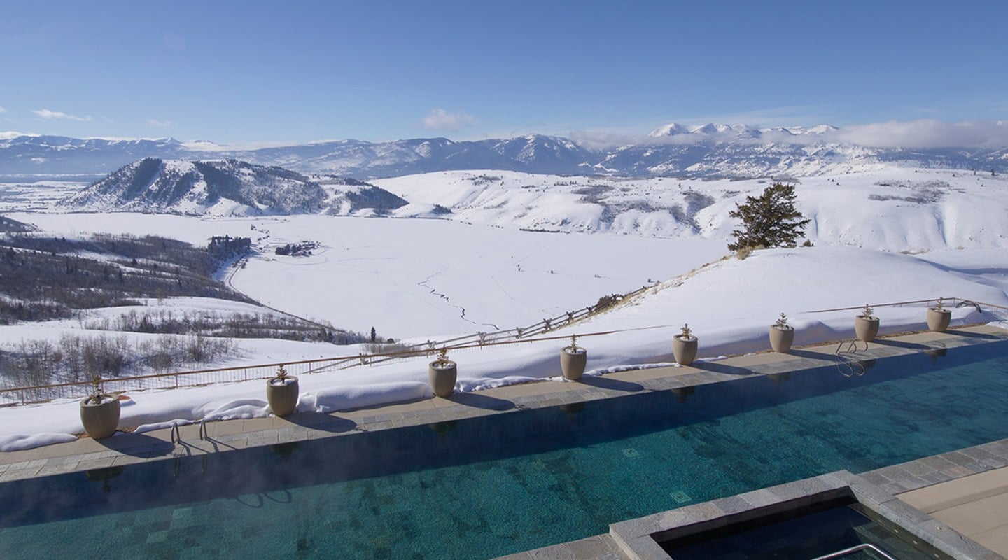Amangani 115-foot outdoor heated infinity pool overlooking snowy Tetons