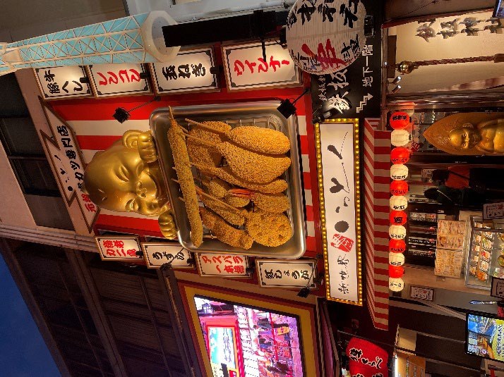 Dotonbori neon canal night district in Osaka Japan with Glico sign