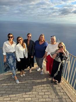 Travel advisors gathered at a panoramic coastal overlook high above the Atlantic Ocean in Madeira Portugal