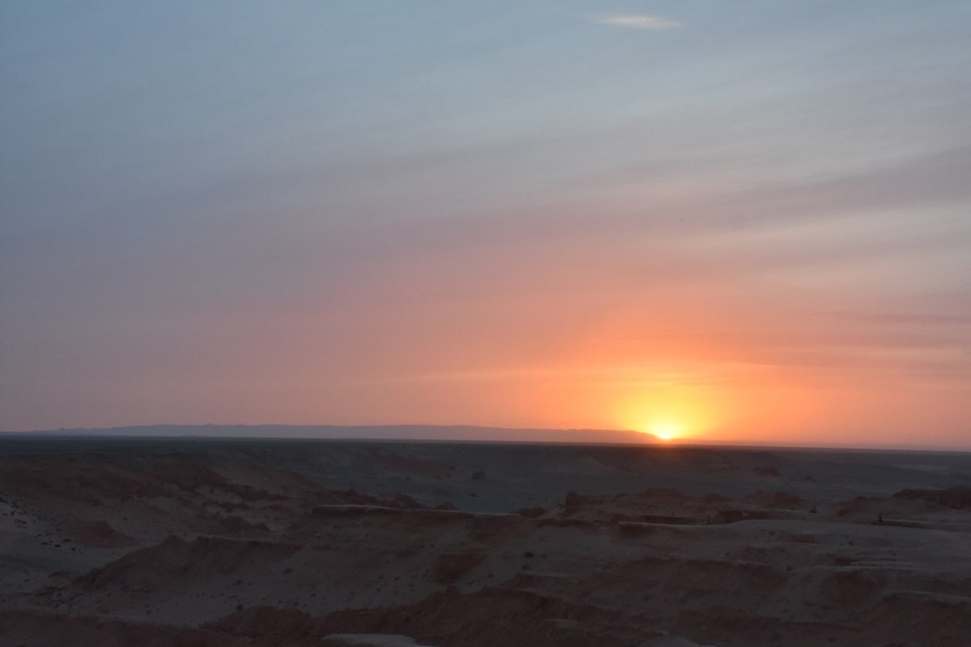 The Flaming Cliffs glowing in brilliant deep crimson and fiery orange at sunset
