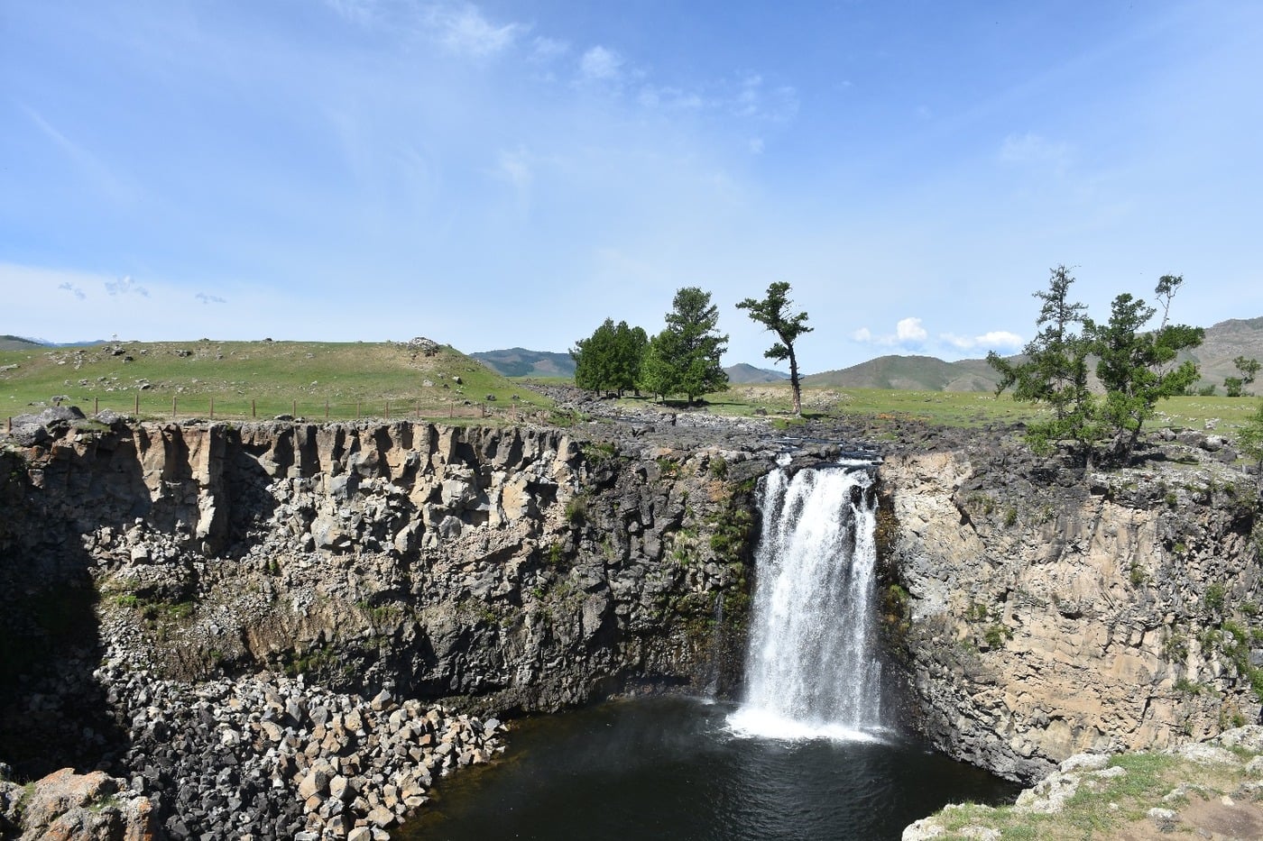 The thunderous 20-meter Orkhon Waterfall plunging into a basalt canyon on the Red River