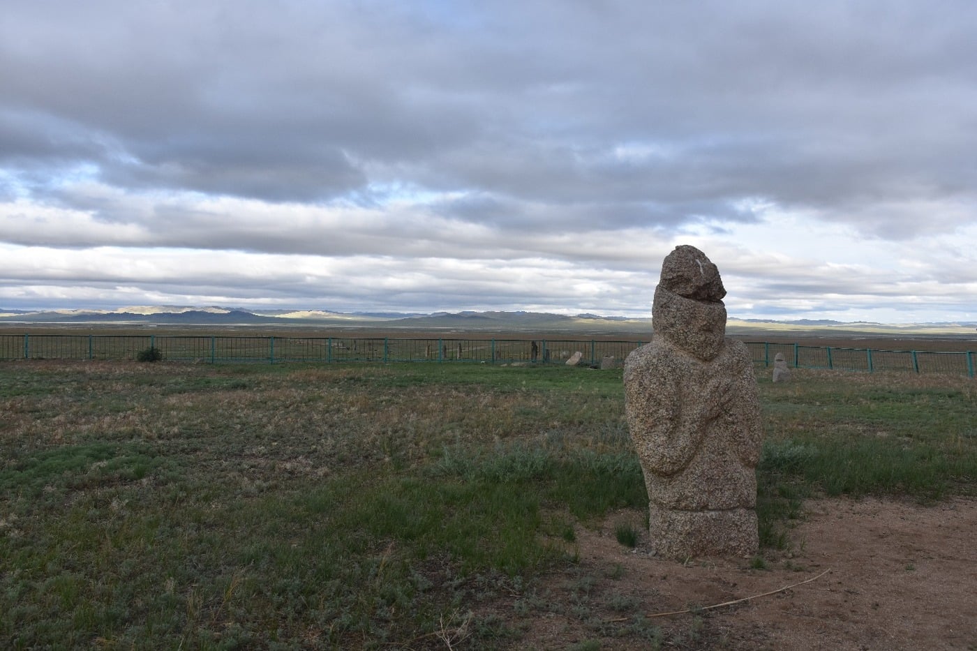 Ancient Turkic stone men carved monoliths at a historical steppe burial site