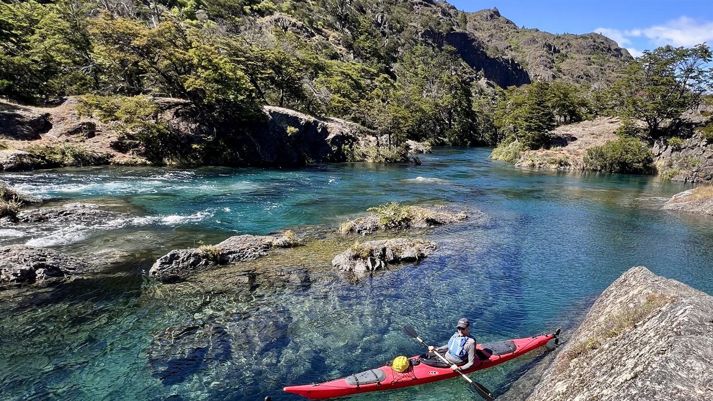 Kayaking on the crystalline turquoise Cochrane River in Chilean Patagonia