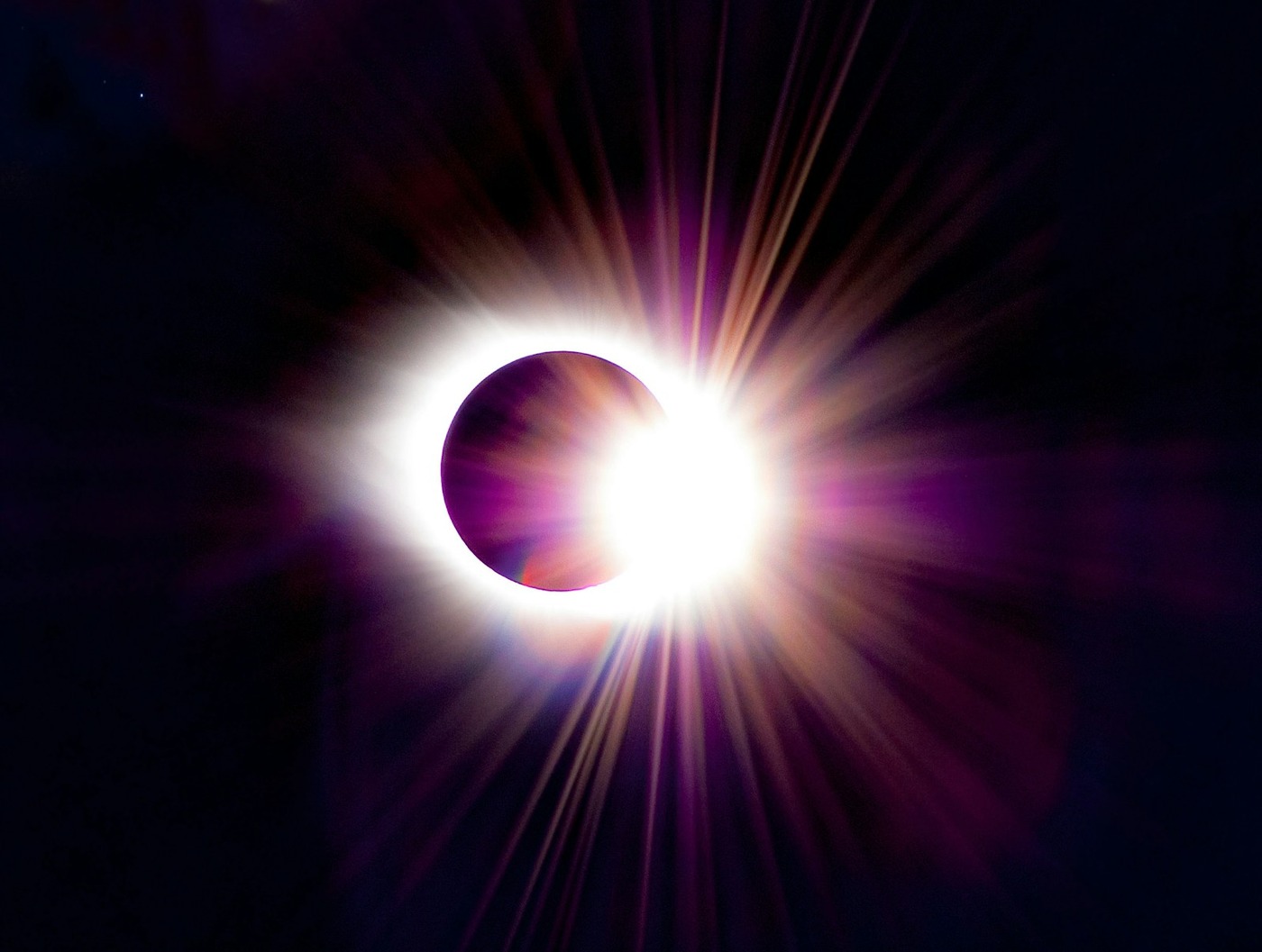 The blinding diamond ring effect as sunlight reappears behind the moon