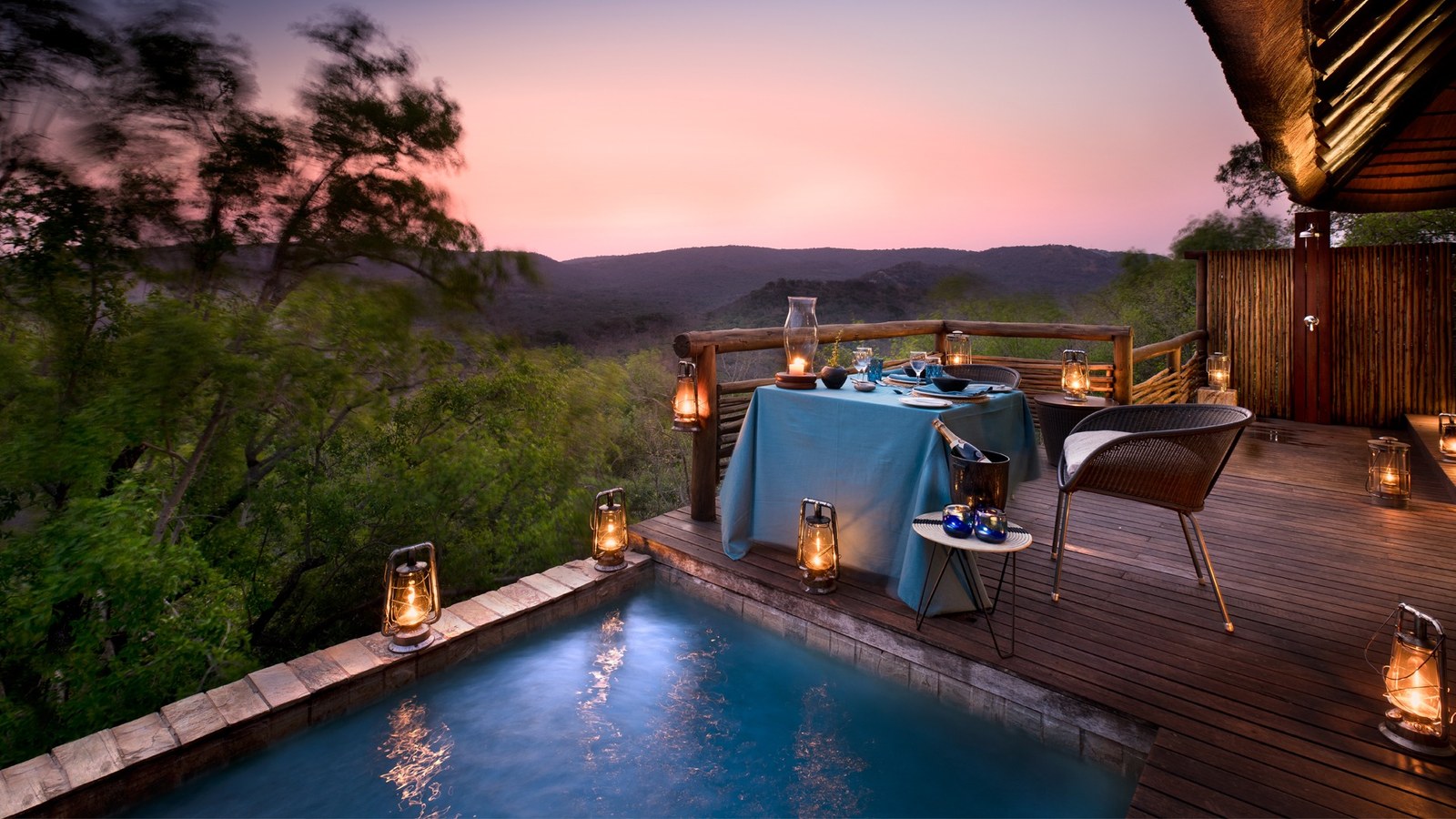 Outdoor boma dining under the African stars at andBeyond Phinda Mountain Lodge