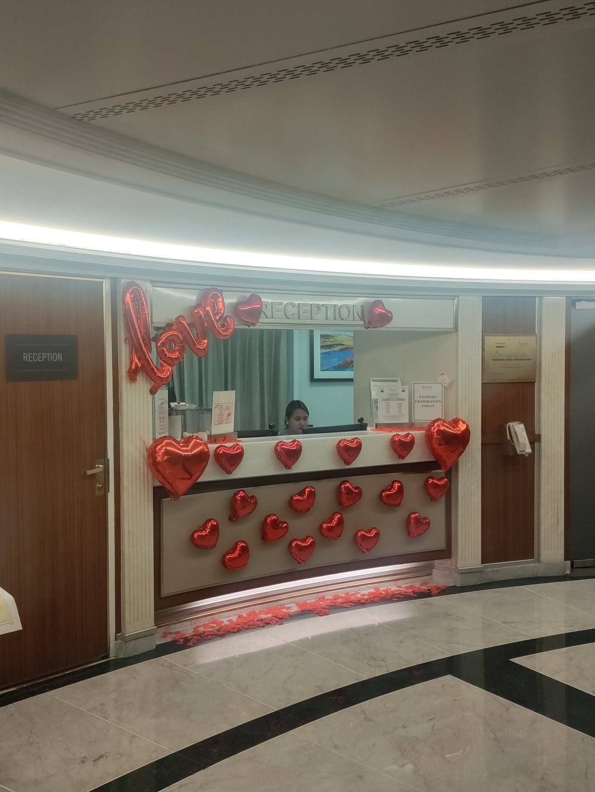 Windstar Star Legend reception desk decorated with red heart balloons for Valentines Day