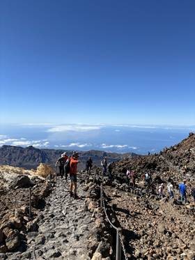Majestic silhouette of Mount Teide volcano rising above the clouds