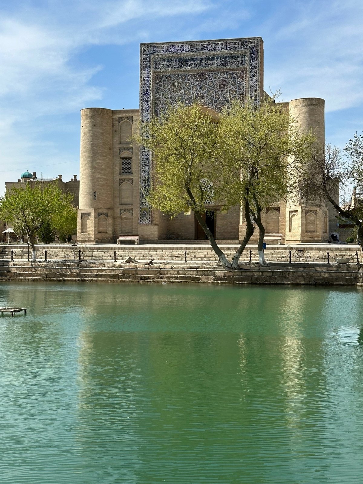Lyabi-Hauz ancient reservoir shaded by mulberry trees in Bukhara