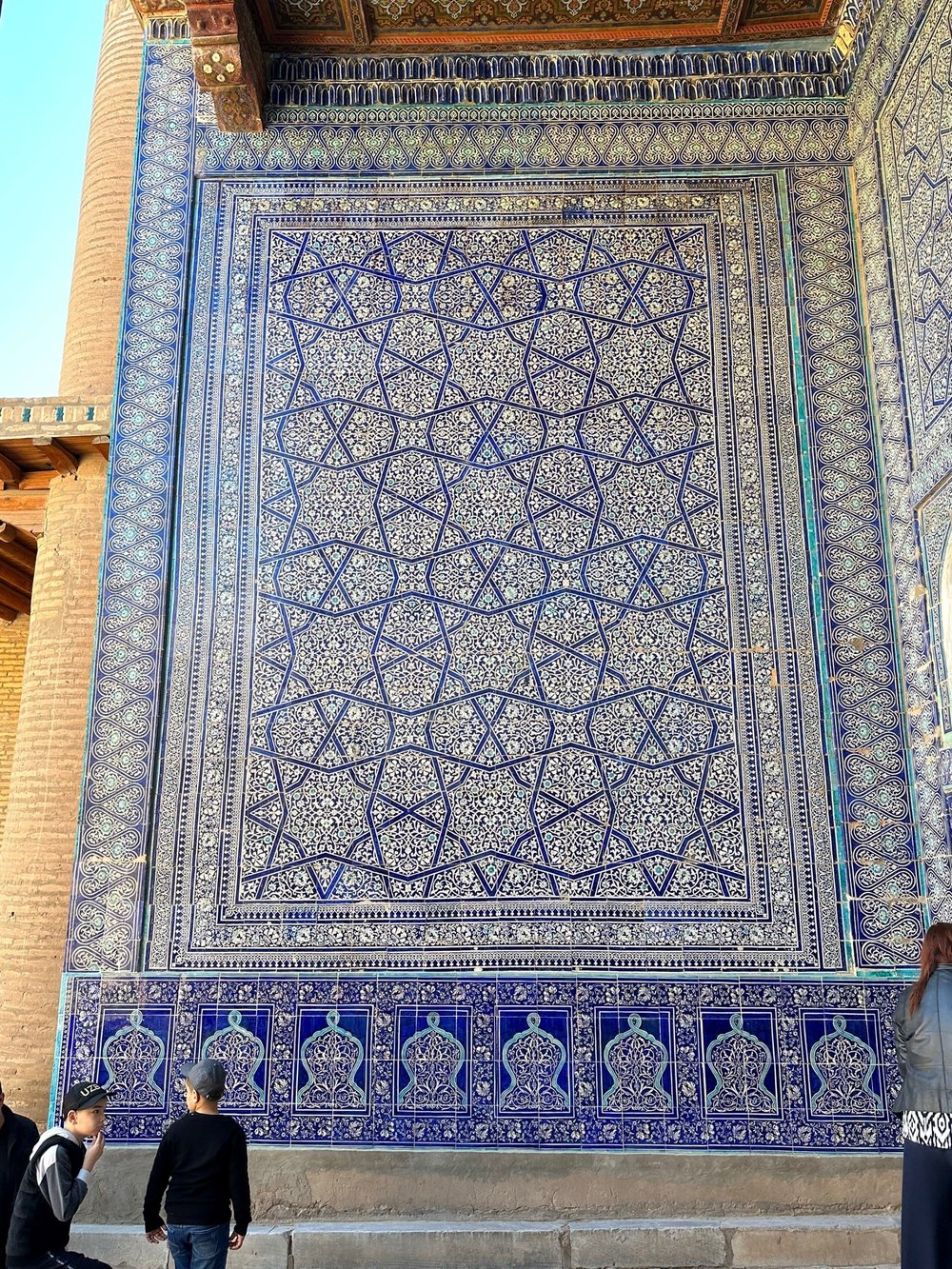 Intricate blue and white majolica tilework in Khiva madrasa
