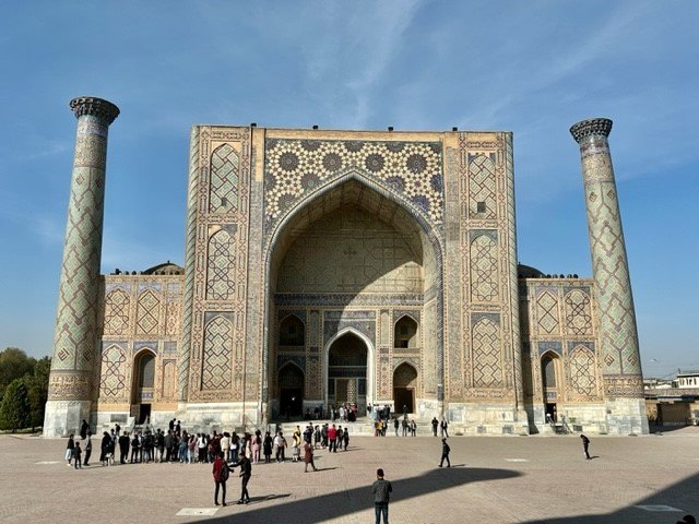 Intricate mosaic tilework on Ulugh Beg Madrasa facade