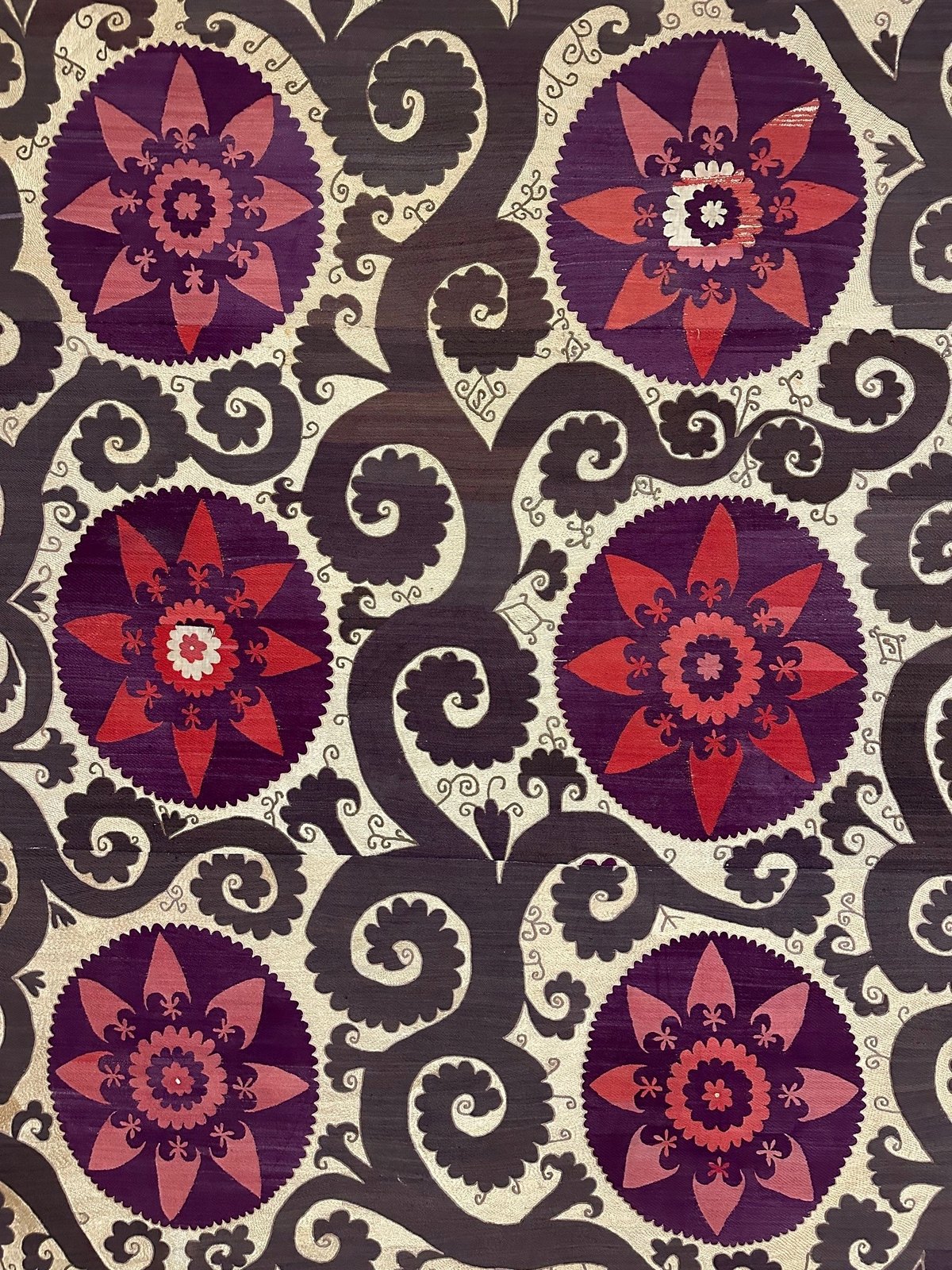 Traditional hand-embroidered Uzbek suzani textile tapestries