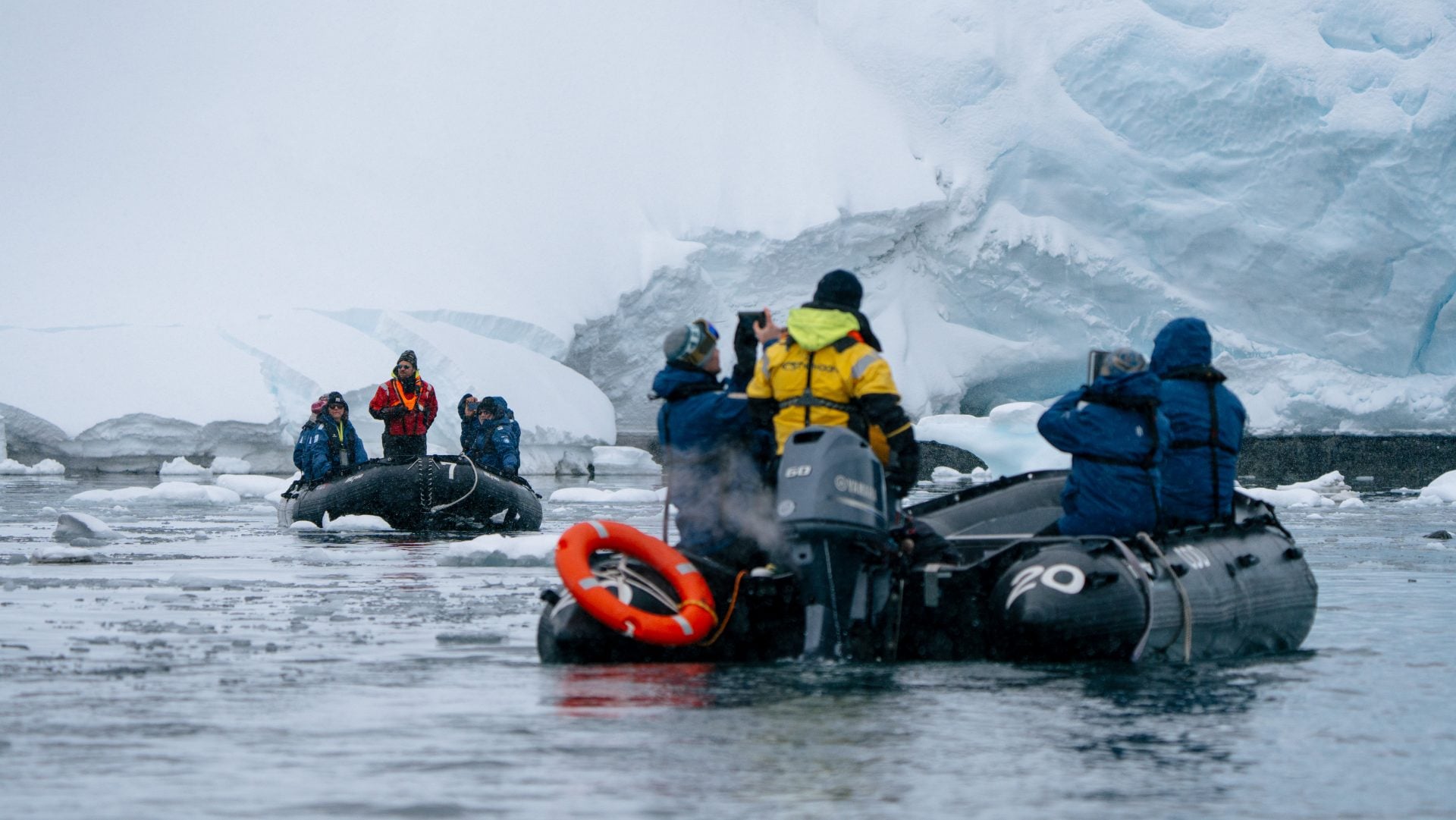 Zodiac navigating dense brash ice and turquoise pack ice around Enterprise Island