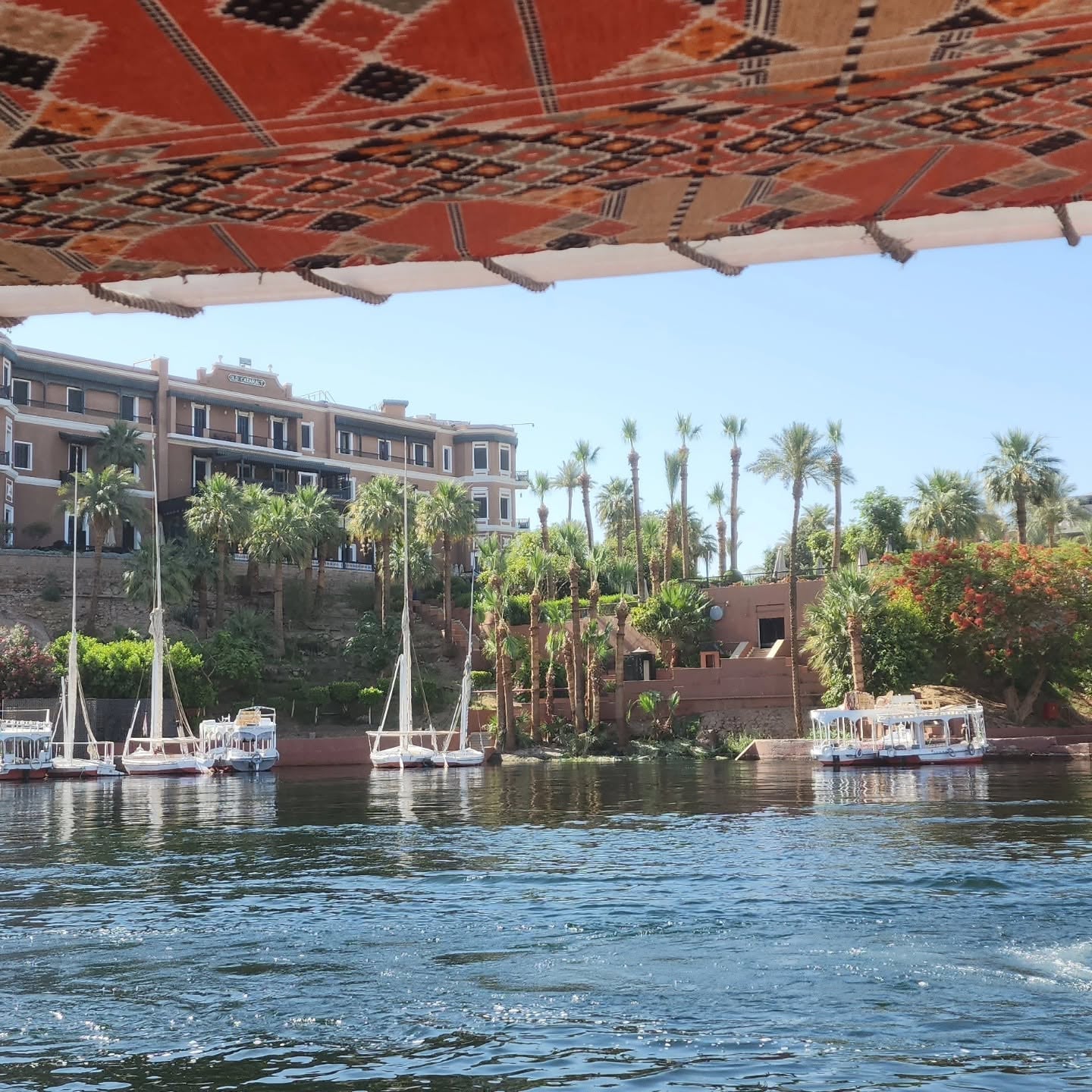 Traditional Felucca Sailing Past Historic Old Cataract Hotel Aswan