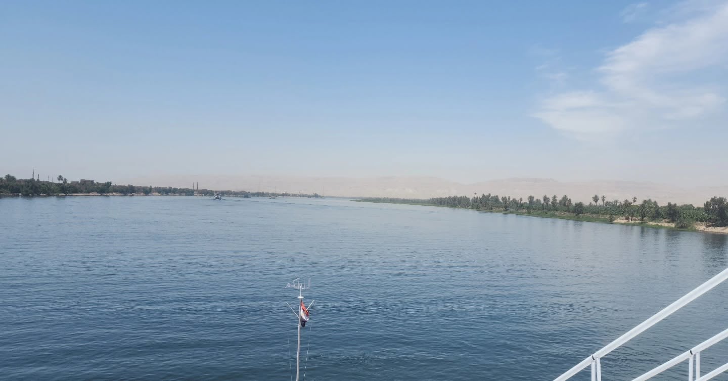 Lush Nile Riverbanks and Golden Desert Dunes