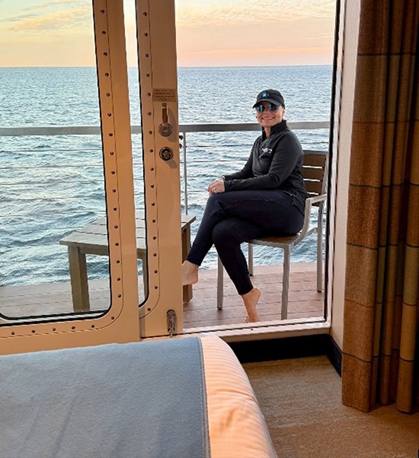 Rosie Ferrara in her balcony stateroom aboard National Geographic Venture