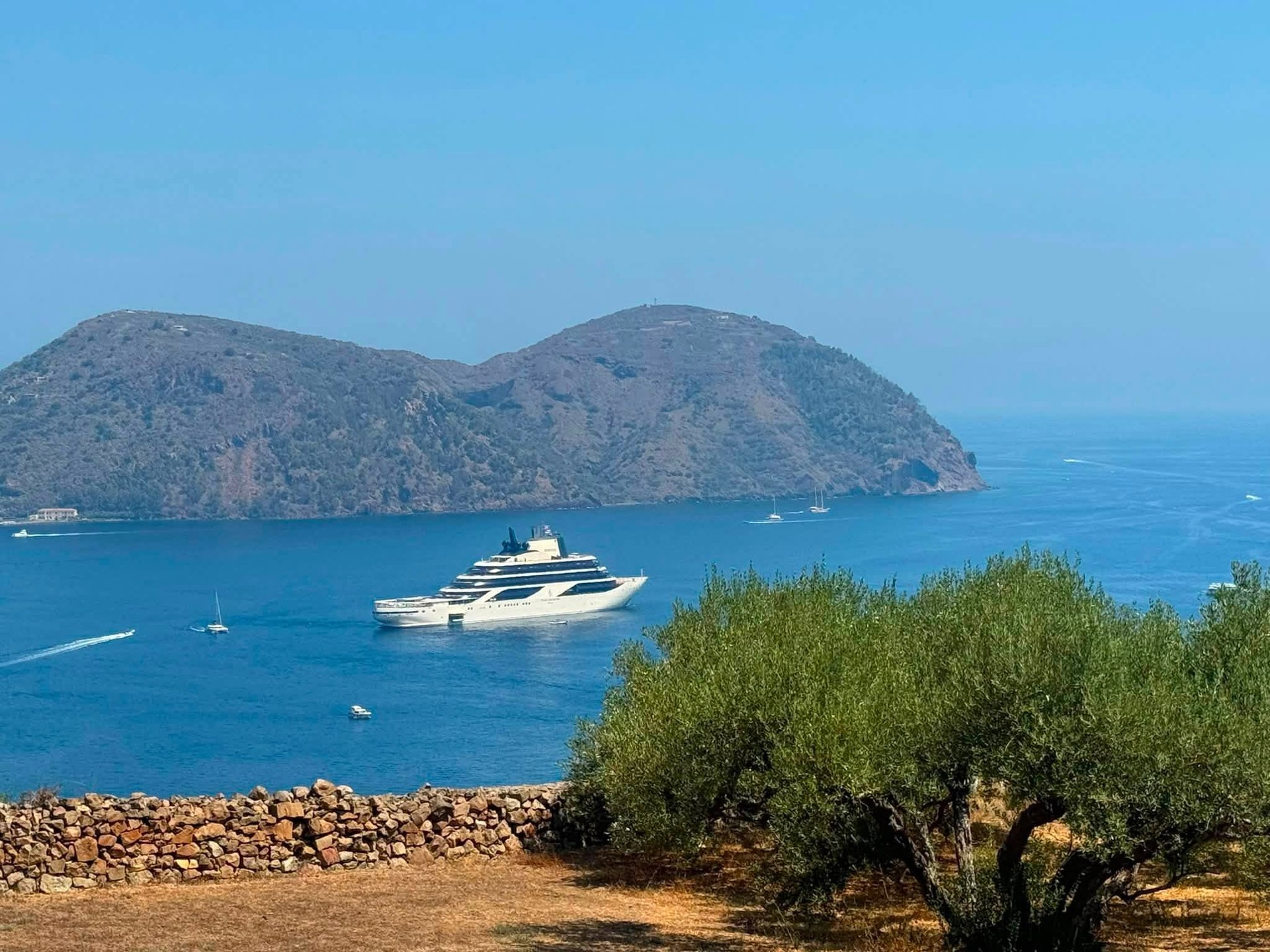 Four Seasons I anchored peacefully in an Aegean bay framed by olive groves