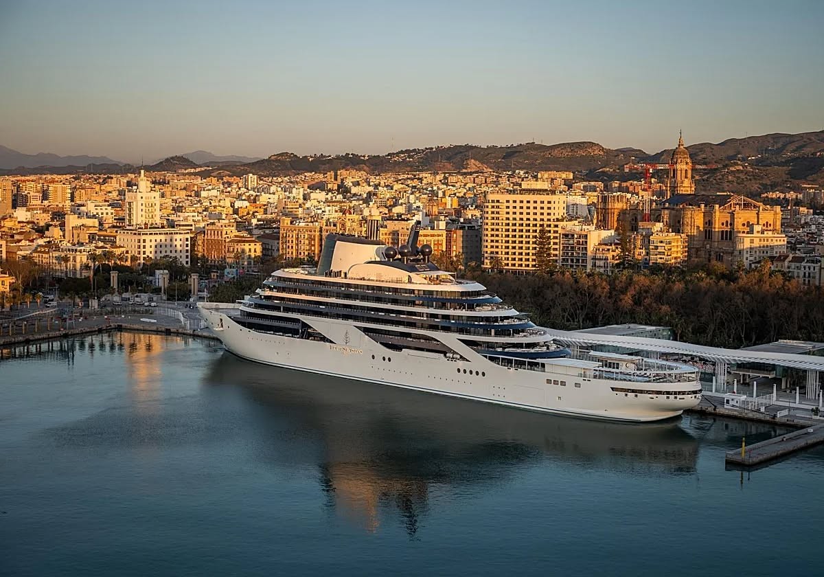 Four Seasons I superyacht docked at golden hour in a glamorous Mediterranean harbor