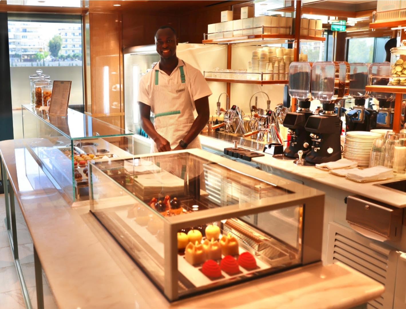 Chef preparing fresh culinary creations at open gourmet counter aboard Four Seasons Yachts