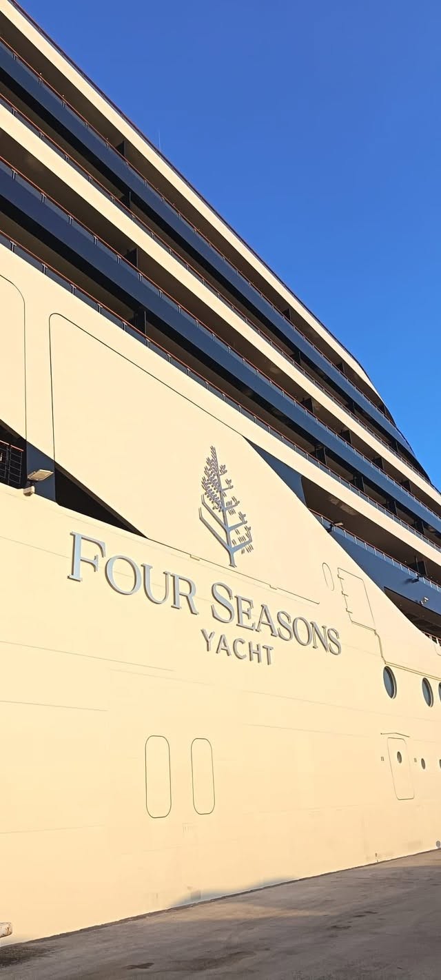 Embossed Four Seasons Yacht insignia lettering on the custom yacht hull