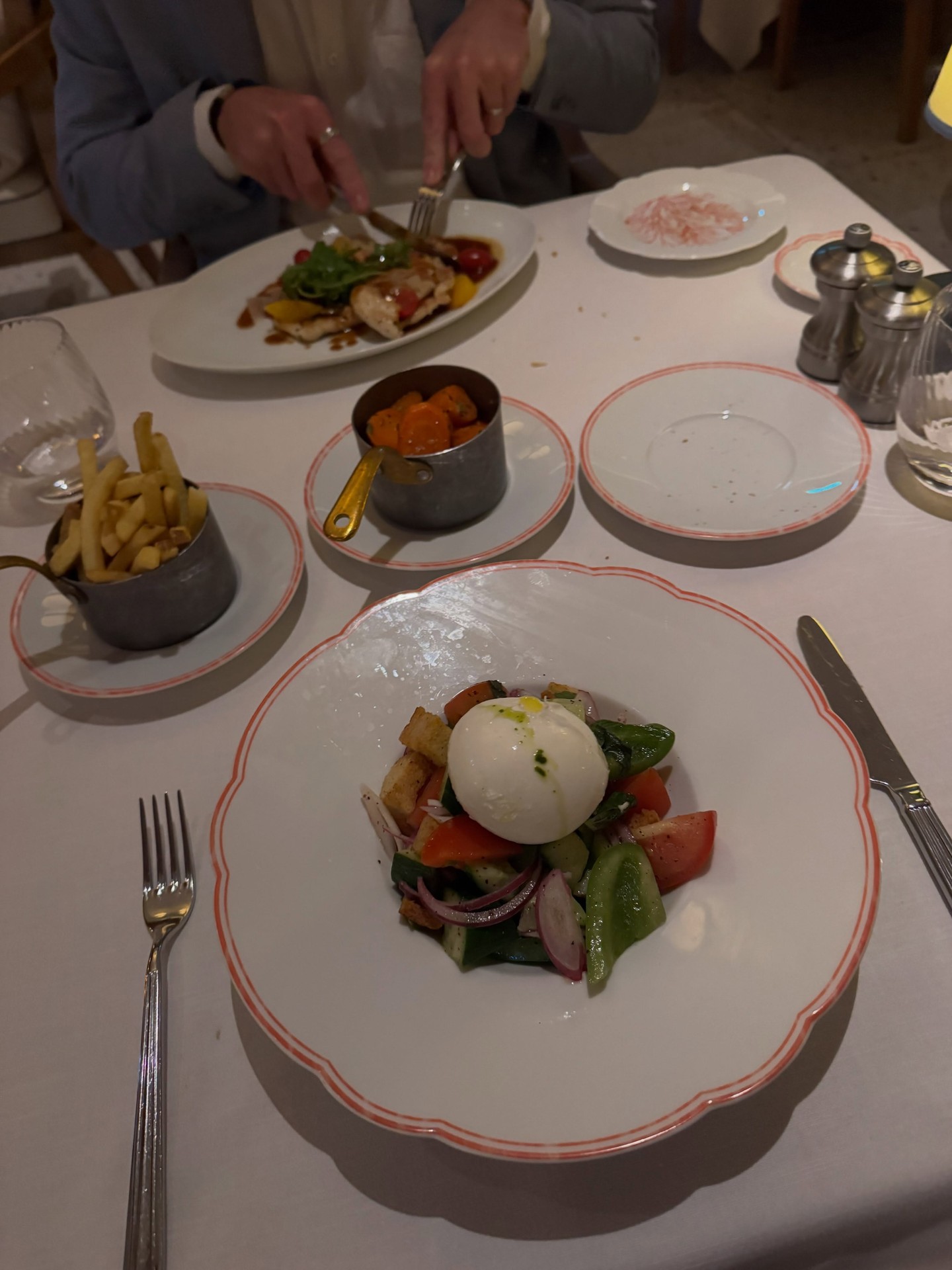 Exquisite multi-course gourmet dinner with artisanal burrata and wine on Four Seasons Yachts