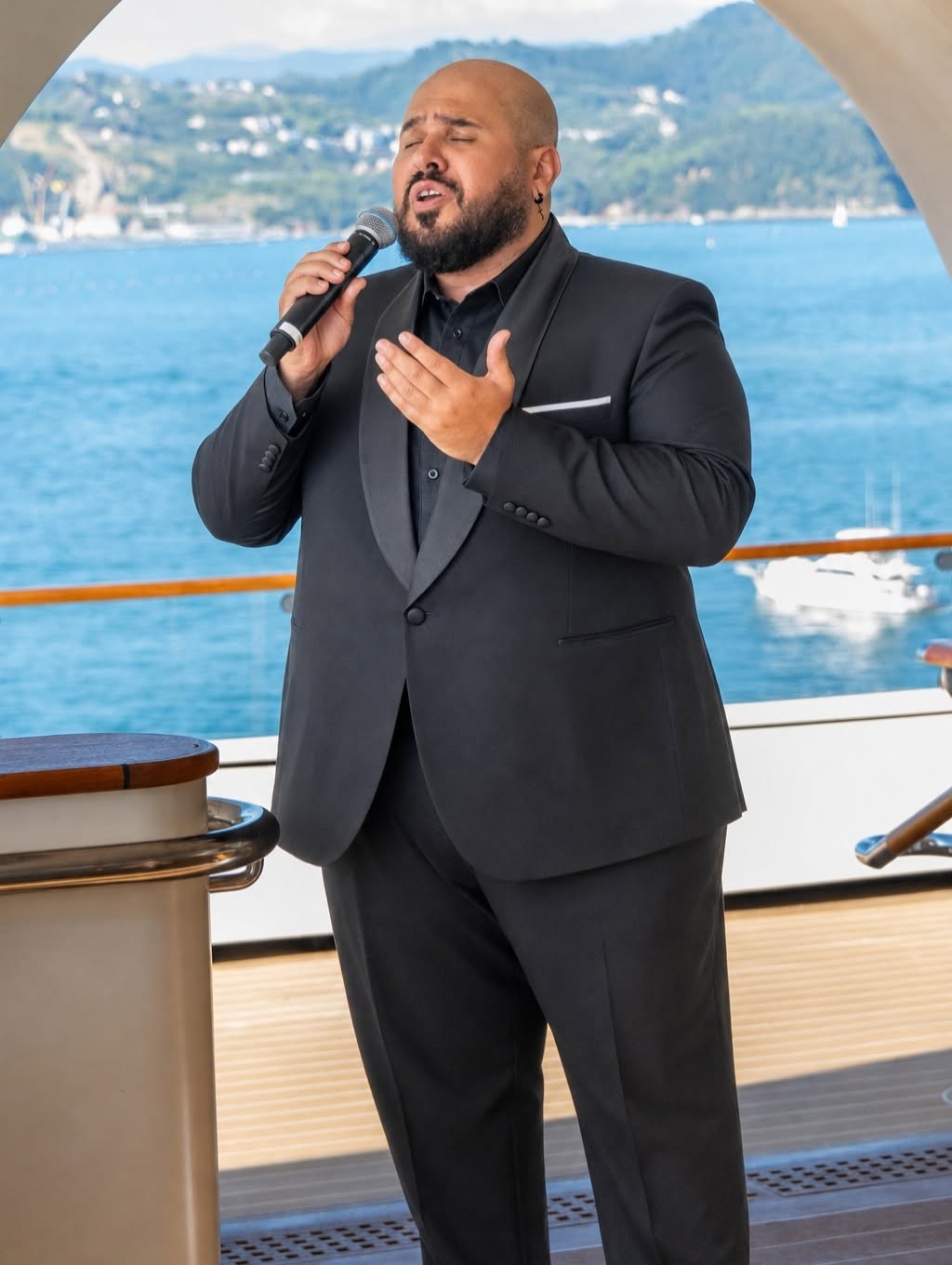 Live musical vocal performance during evening cocktail hour on Four Seasons Yachts