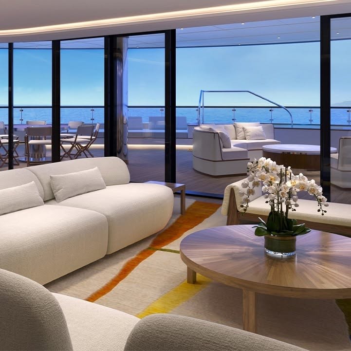 Saint Tropez Suite luxury salon living room with designer curved sofa on Four Seasons Yachts