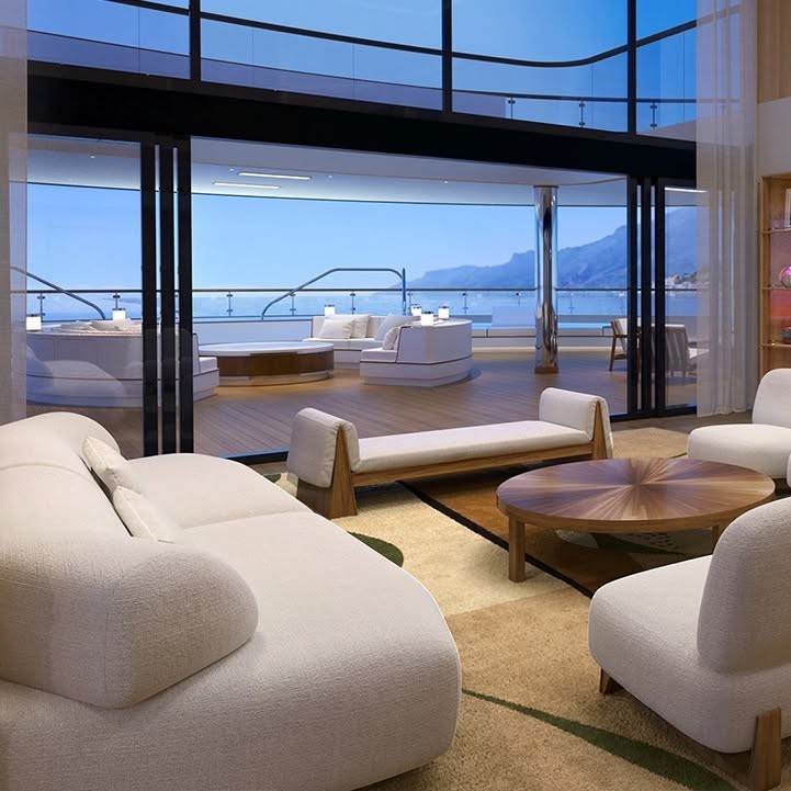 Floor-to-ceiling glass sliding doors opening to private teak terrace on Four Seasons Yachts