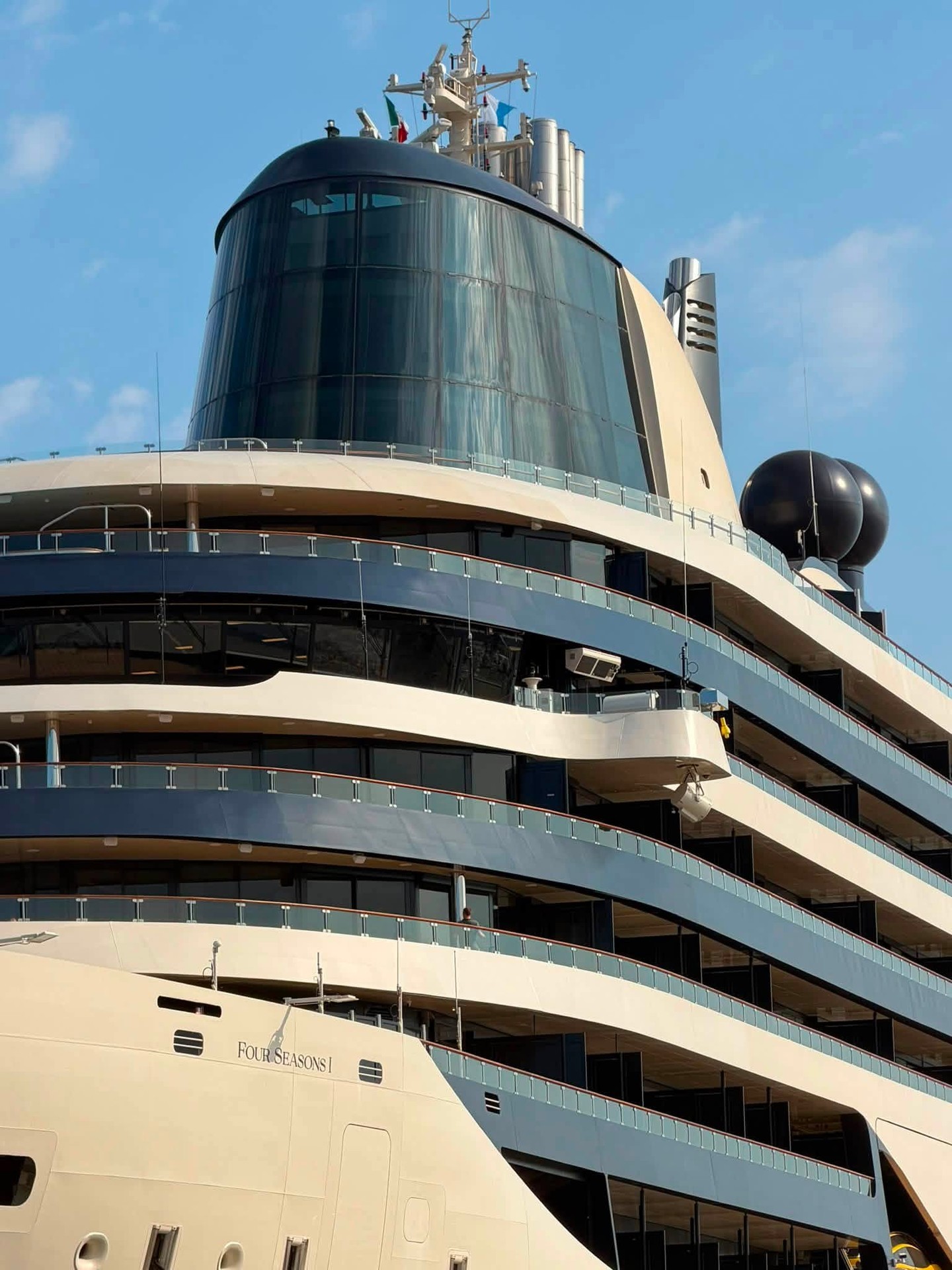 Tiered aft decks and architectural glass funnel structure on Four Seasons Yachts