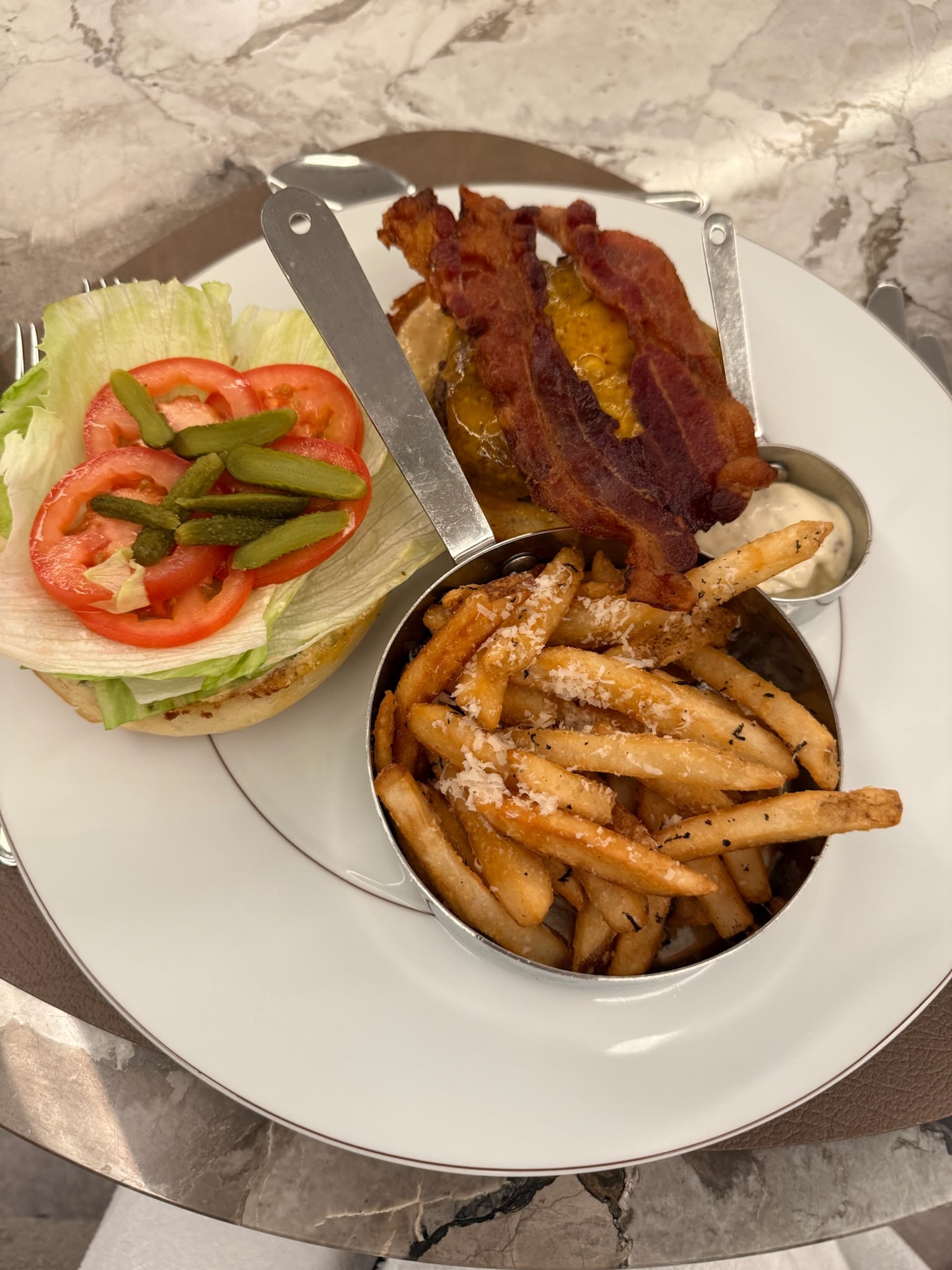 Gourmet poolside burger with crispy truffle fries