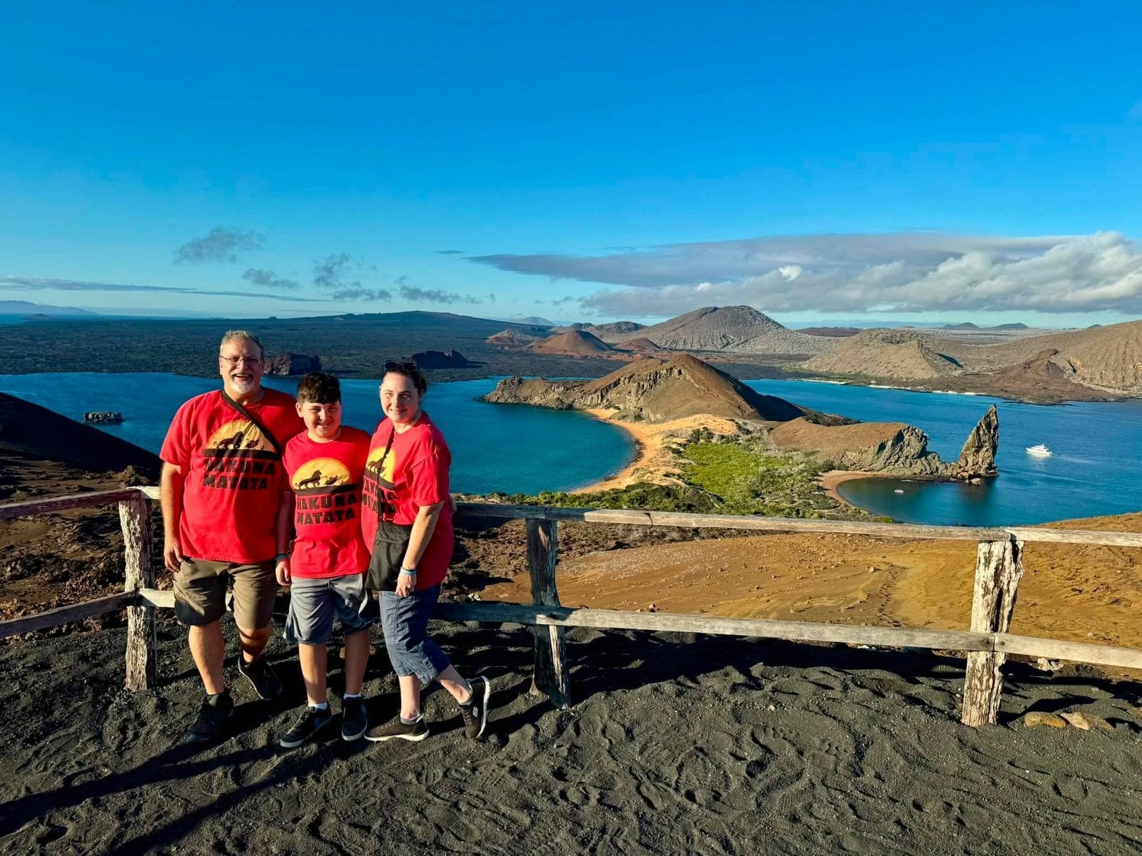 Johnnie Herring and family at the summit of Bartolome Island overlooking Pinnacle Rock on Adventures by Disney Galapagos Expedition
