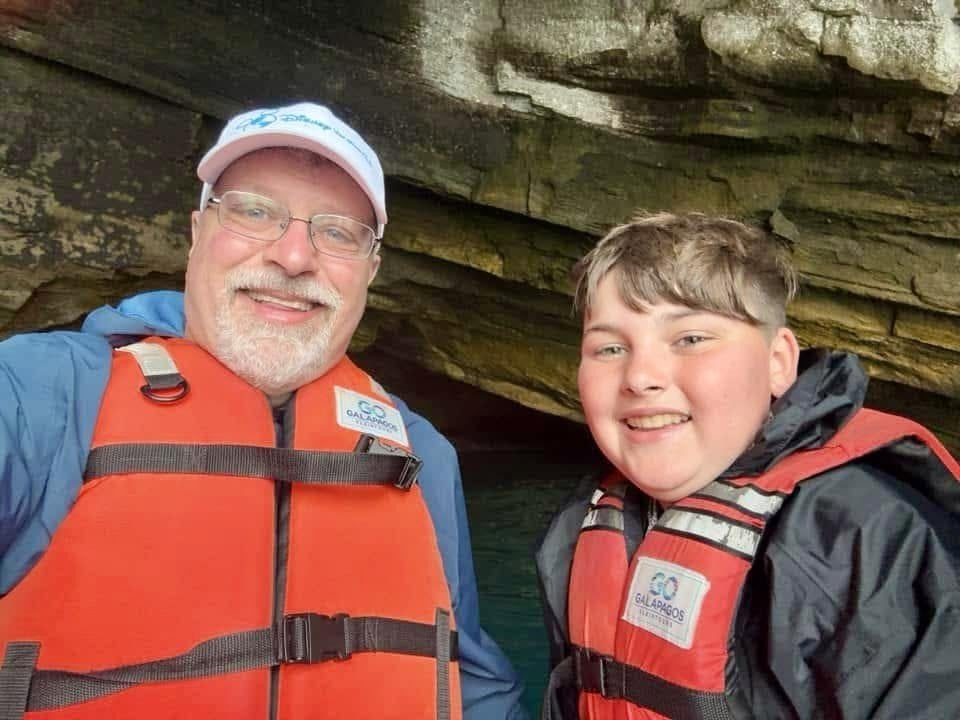 Exploring the dramatic sea caves and volcanic cliffs by panga with Adventures by Disney